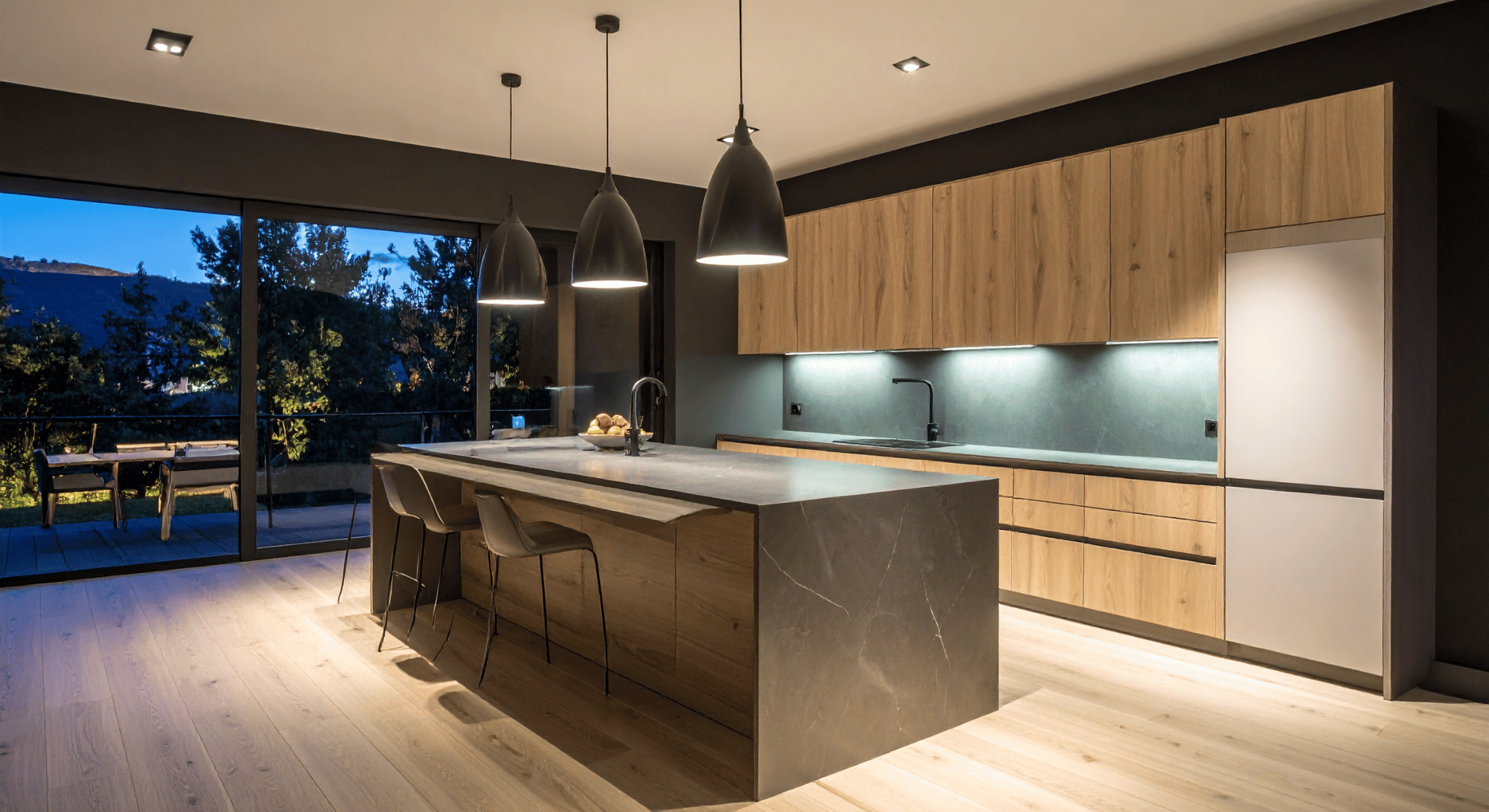 Warm terracotta modular kitchen with brass handles and everyday cooking essentials in an Indian home